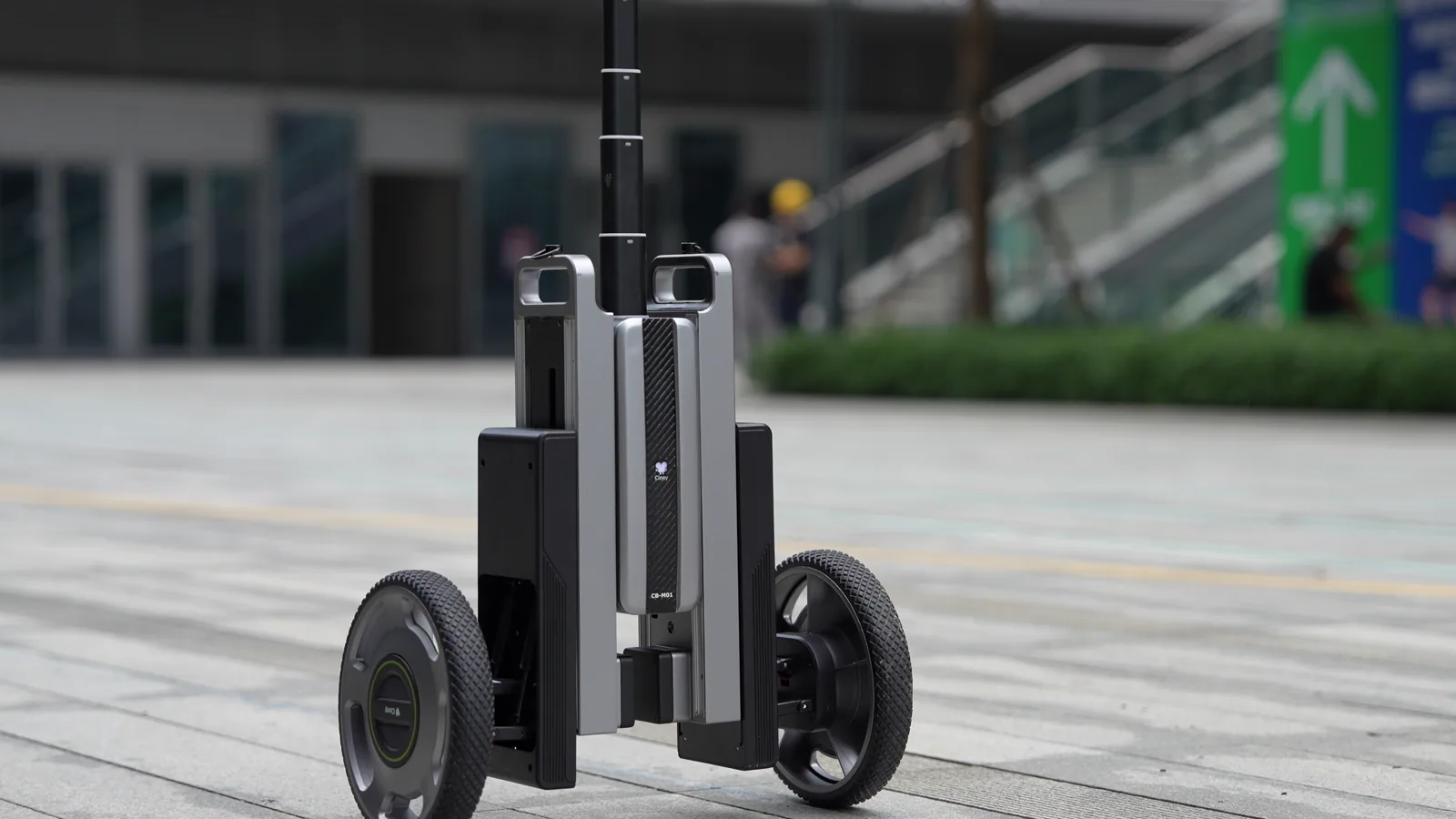 Close-up of the CineyBot wheelbase moving across a paved plaza