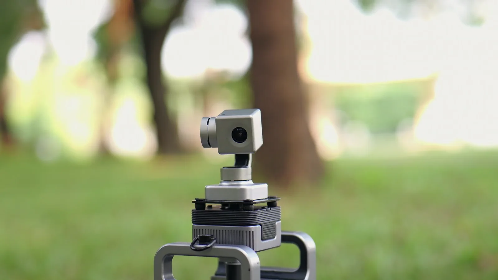 Close-up of the CineyBot camera gimbal in a sunlit park
