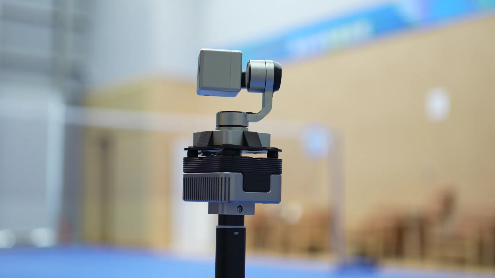 The CineyBot camera gimbal turning at a badminton court