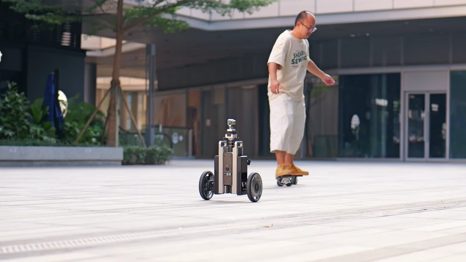 CineyBot following a skater across the plaza