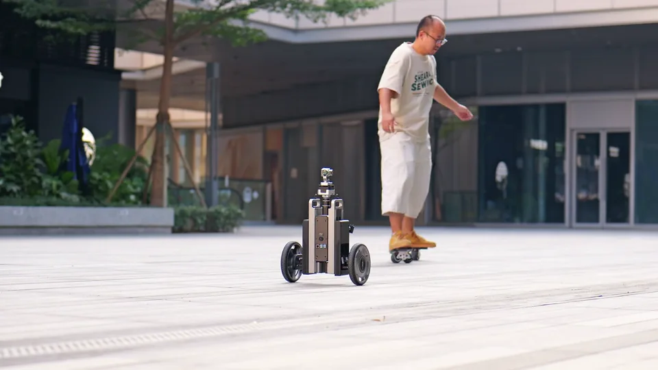 CineyBot following a skater across the plaza