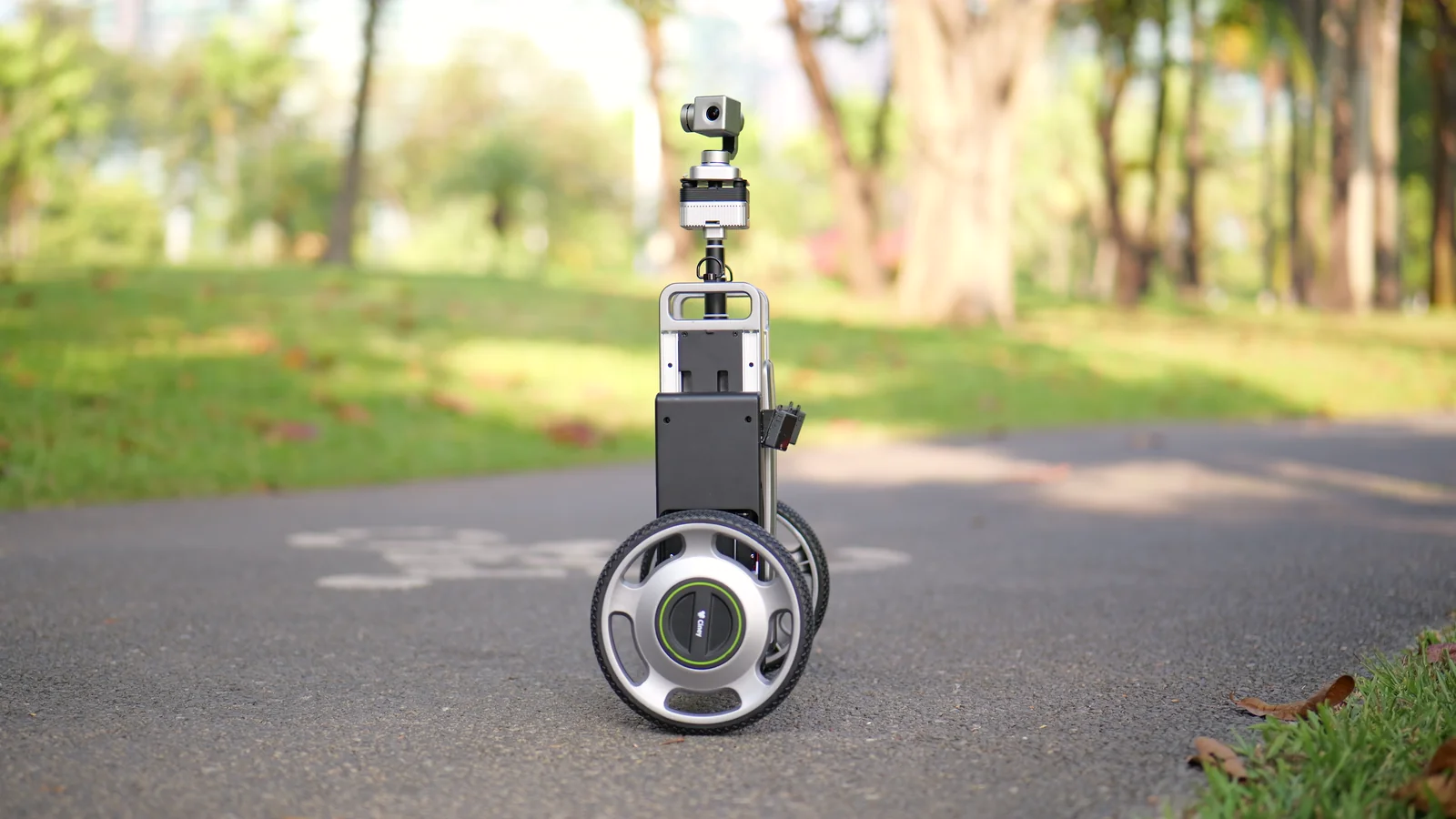 A side view of CineyBot moving along a park path