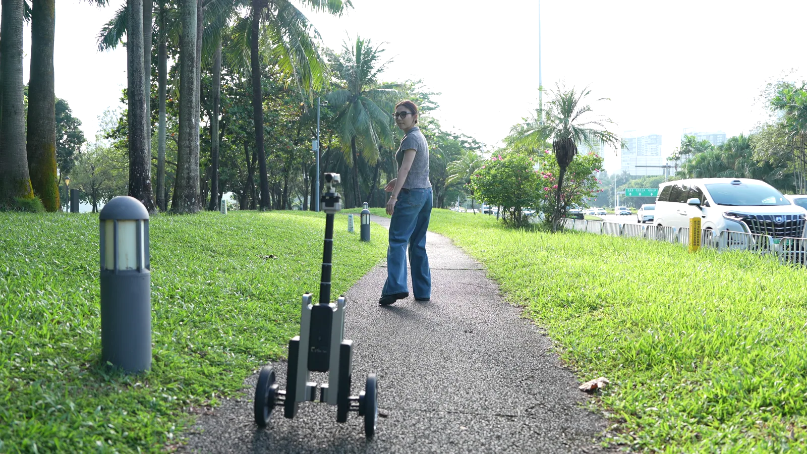CineyBot following its subject during a walk in the park