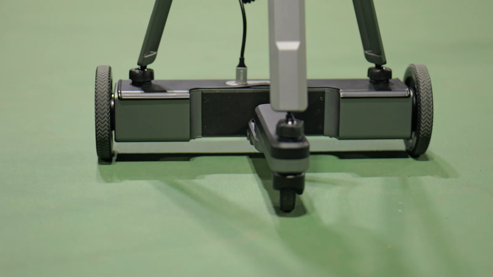 The Tribot three-wheel base moving on a pickleball court