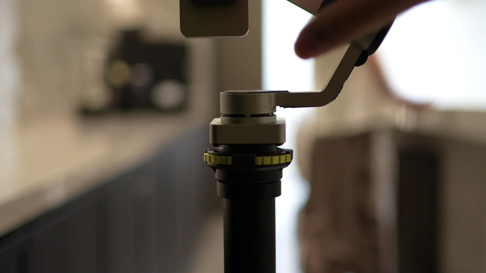 Hands adjusting the gimbal mount on Tribot